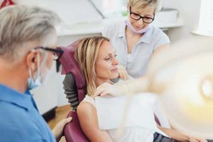 Woman getting restorative dentistry services in Austin, Texas
